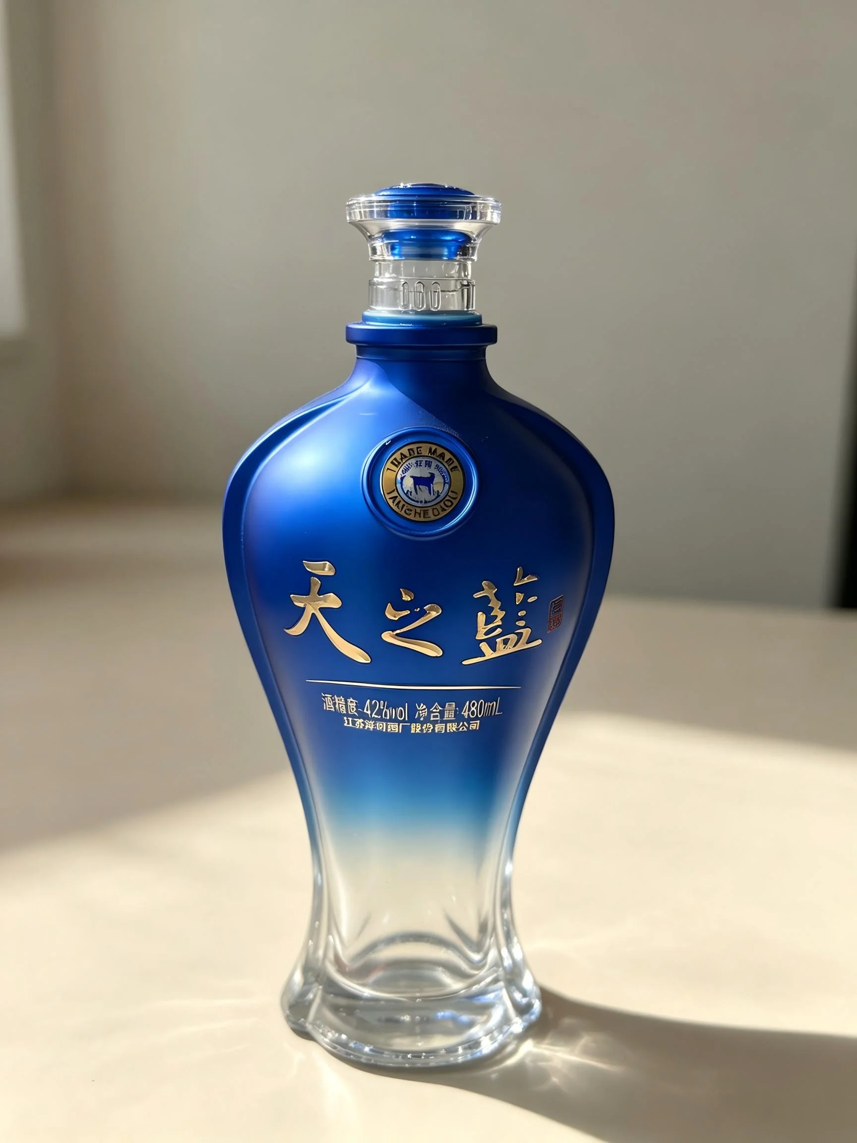 Blue gradient decorated glass liquor bottle — decoration sample